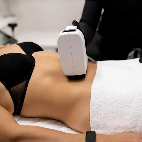 A body contouring applicator worked across a patient's abdomen